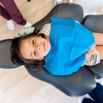 Smiling child visiting children's dentist in Chesapeake Virginia