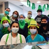 Chesapeake dental team members wearing Saint Patrick's Day outfits